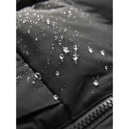 Close-up of a black jacket with water droplets on the fabric