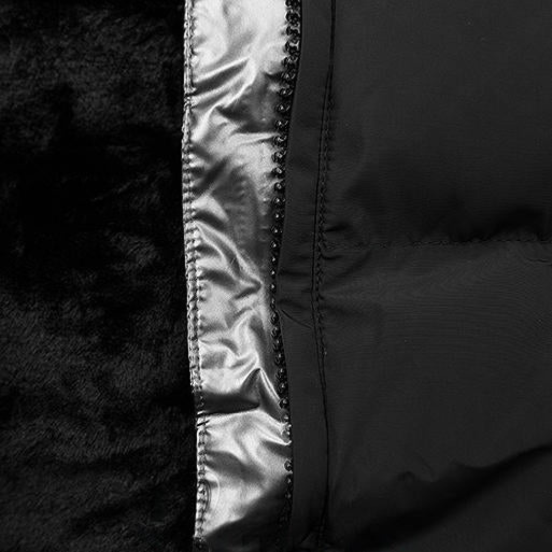 Close-up of a black jacket with shiny trim on a dark background