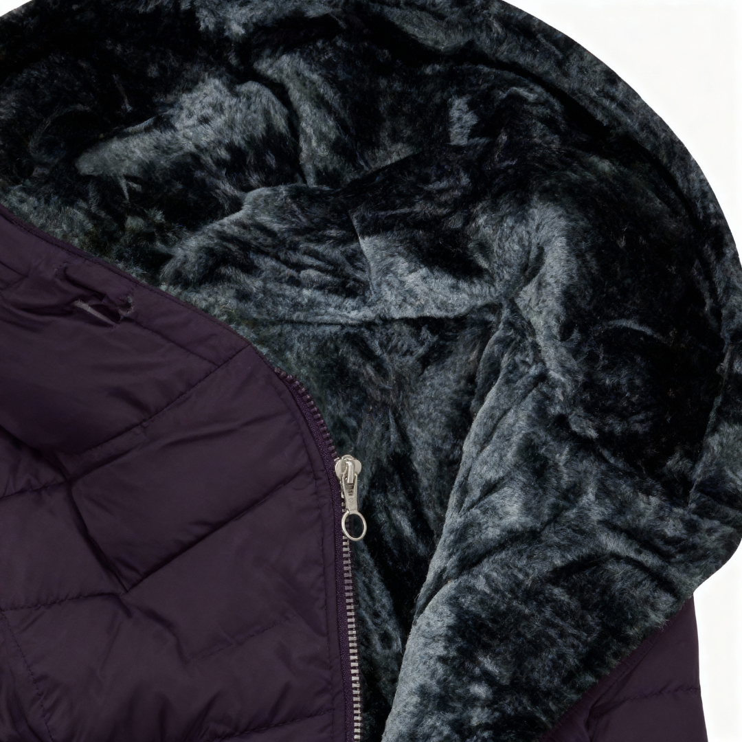 Close-up of a dark purple puffer jacket with a textured hood on a white background